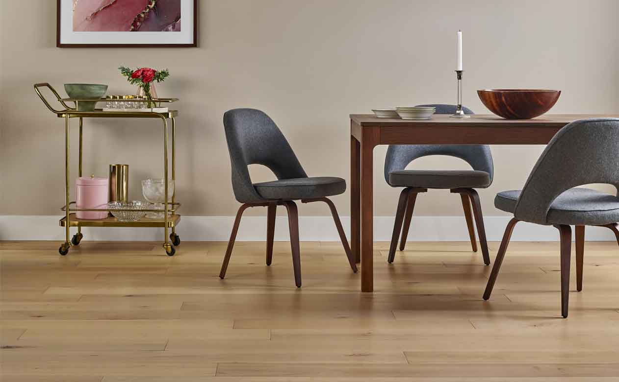hardwood floors, brown dining table, black chairs