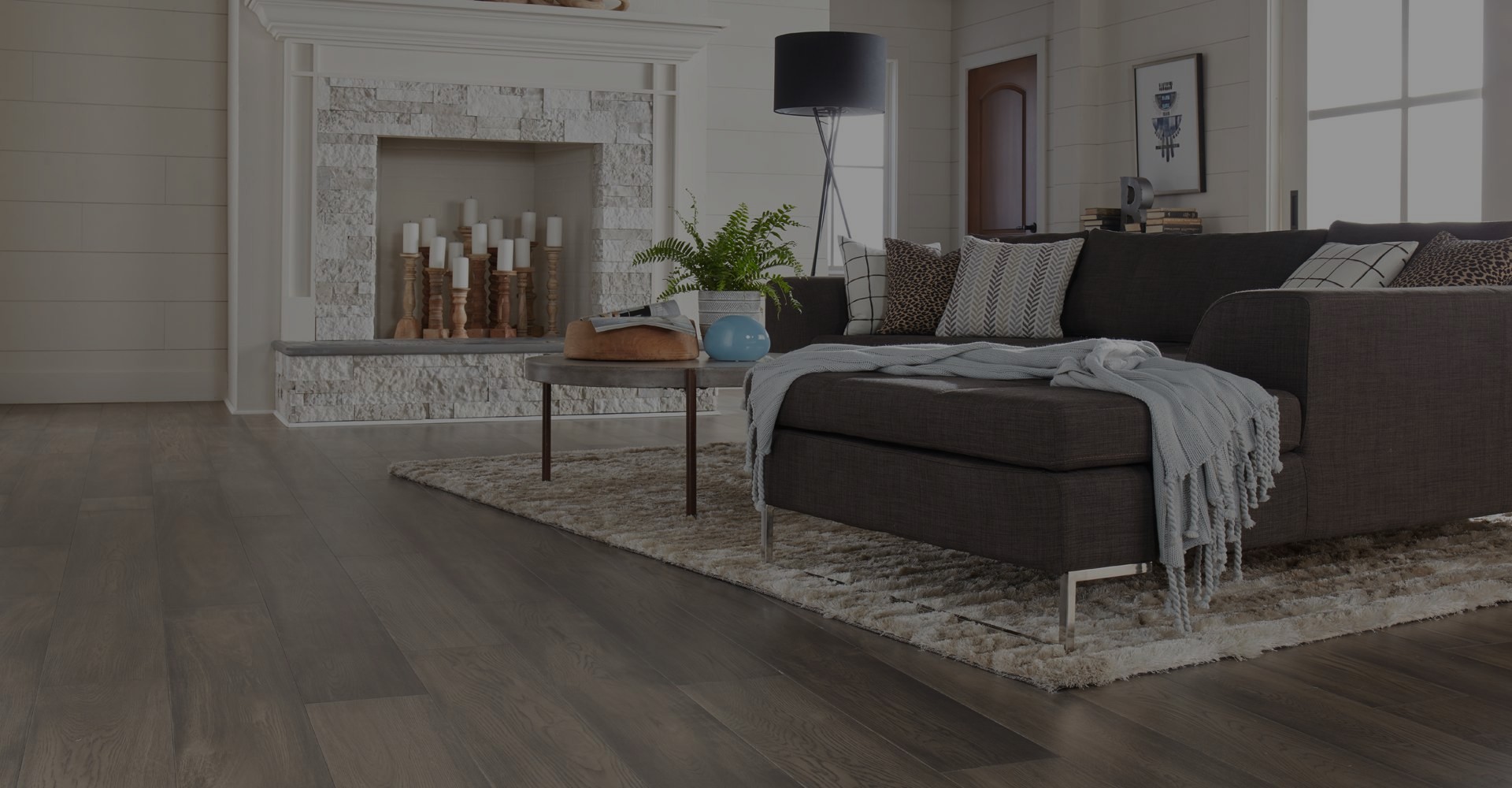 Hardwood flooring and area rug in living room
