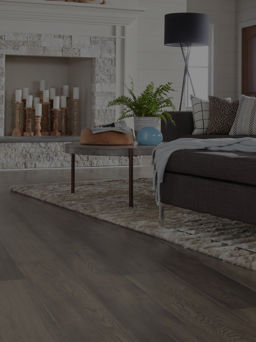 Hardwood flooring and area rug in living room