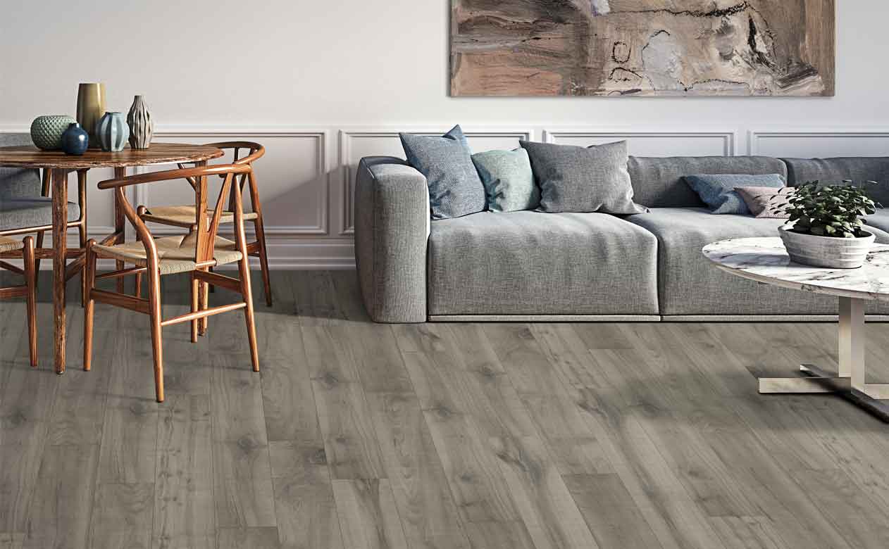 Living room with laminate floor and brown grey couch